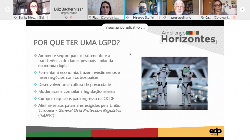 Slide da apresentação com a pergunta "por que ter uma LGPD?" e miniaturas das palestrantes e de alguns dos participantes