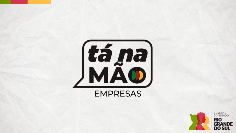 A imagem contém um logotipo no centro com o texto "tá na MÃO EMPRESAS" em preto, dentro de um balão de fala estilizado. À direita do texto, há três círculos representando as cores verde, amarelo e vermelho. No canto inferior direito, o logo do Governo do Estado do Rio Grande do Sul aparece, com três perfis de pessoas estilizados em cores diferentes (verde, vermelho e amarelo). O fundo é branco com um leve efeito texturizado.